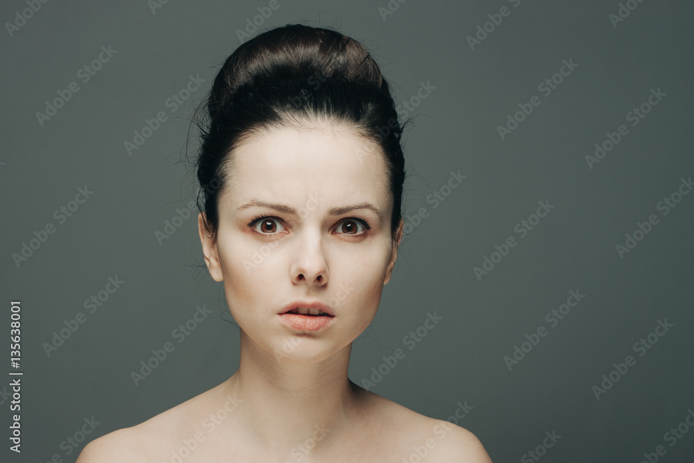 surprised woman, gray background surprised woman, gray background