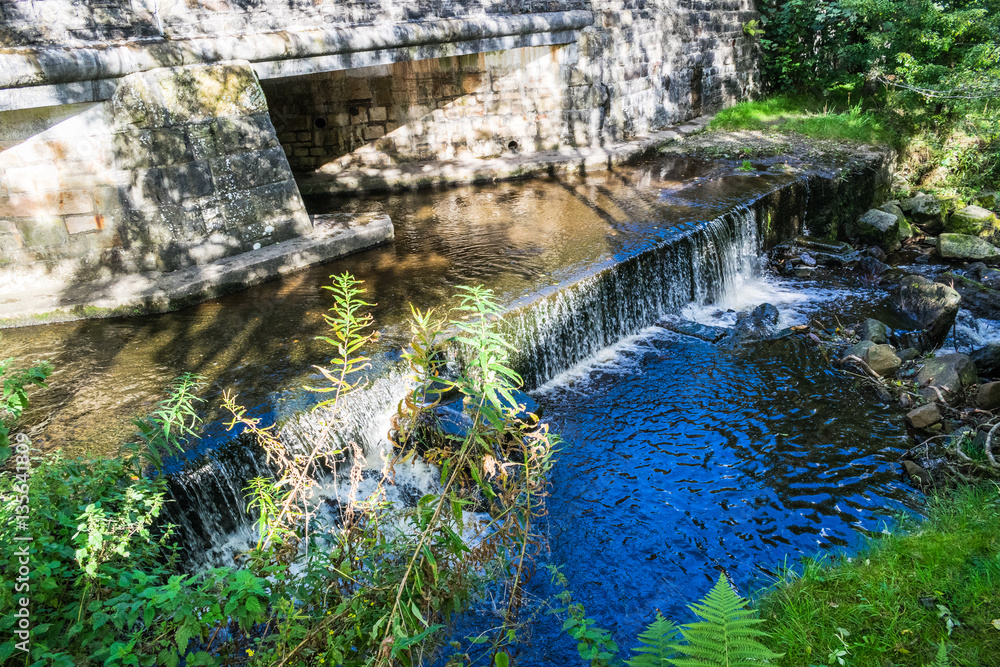 Fototapeta premium Brook and Waterfall, Summer, blue water, Forest Of Bowland, Lancashire, England, UK