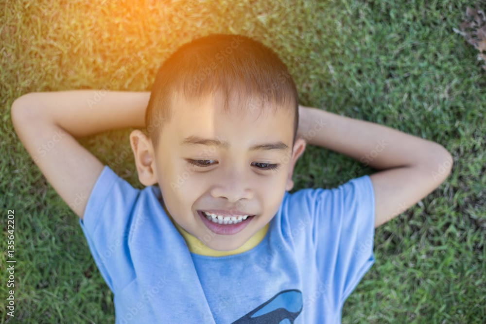 Happy boy child is smiling enjoying adopted life. Portra Happy boy child is smiling enjoying adopted life. Portra