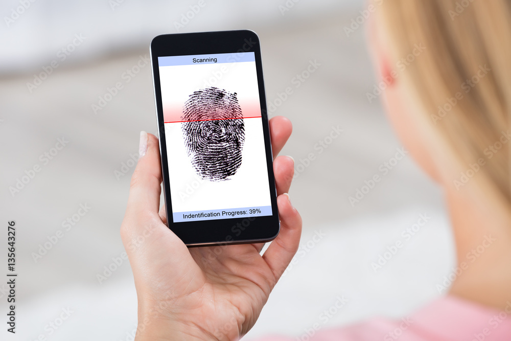 Person With Mobile Phone Showing Fingerprint Scanner