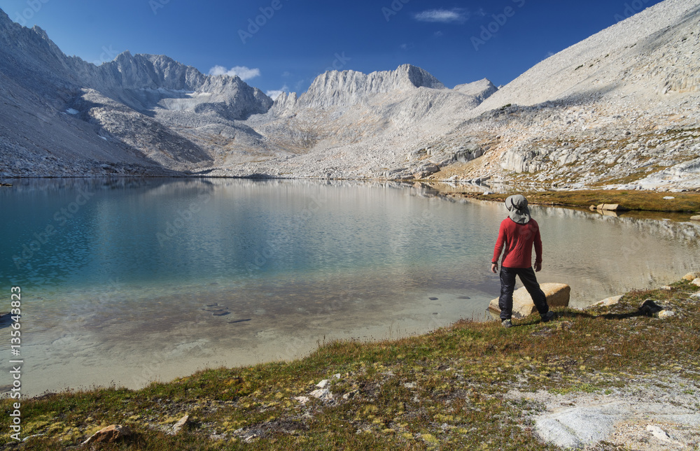 Man on Mountain Lake Shore