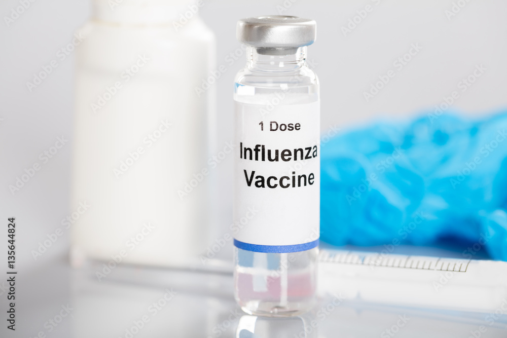 Vial With The Label Of Influenza Vaccine On It Vial With The Label Of Influenza Vaccine On It