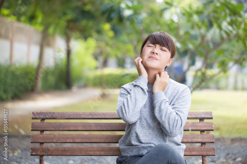 Woman scratching her face