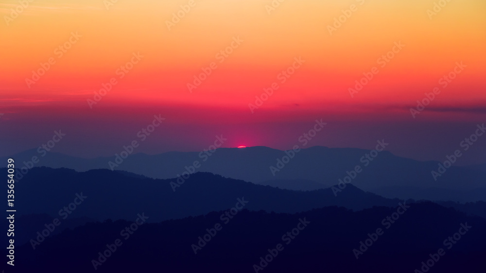 Scenic view of sunset over the mountains