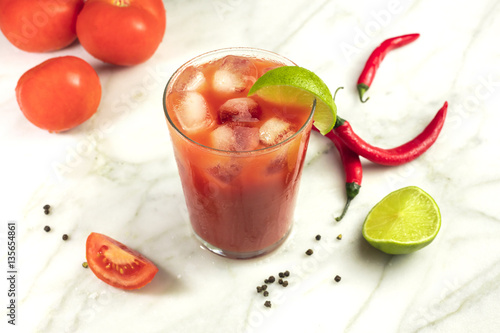Bloody Mary cocktail with lime, tomatoes and chilis