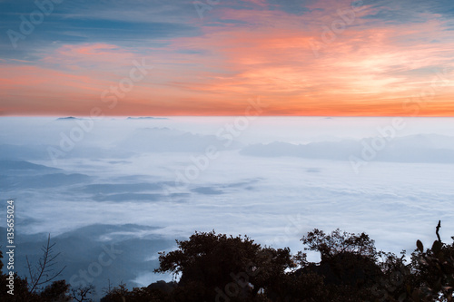 Scenic destination view during sunrise over clouds