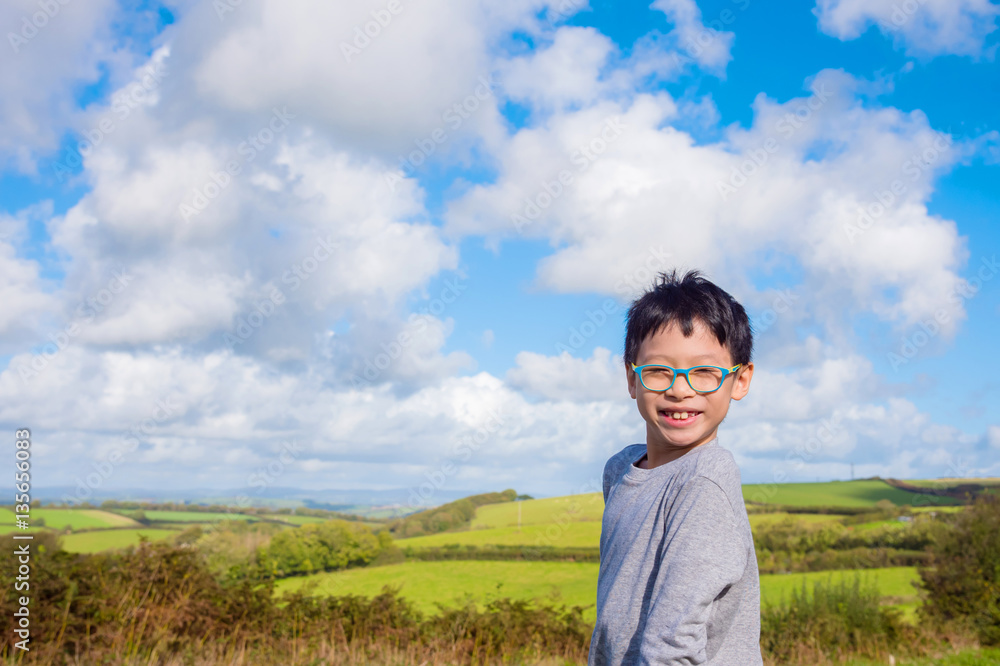 Young asian boy smiling at field Young asian boy smiling at field