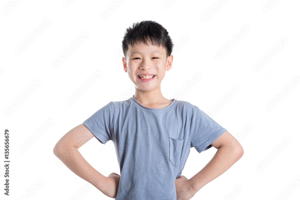 Young asian boy smiling over white background