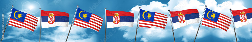 Malaysia flag with Serbia flag, 3D rendering Malaysia flag with Serbia flag, 3D rendering