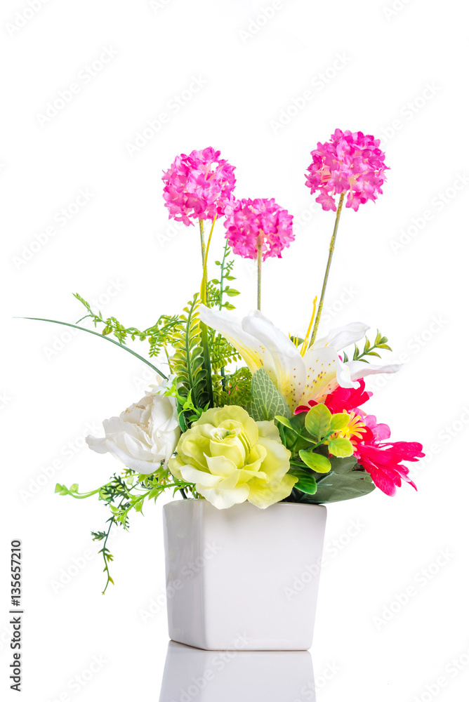 Fototapeta premium Artificial flower in flower pot isolated over white