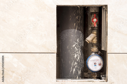 Old or new dirty water counter in apartment durind renovation photo