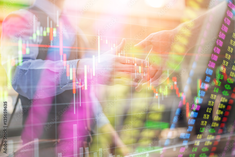 business deal success with business man handshake on financial graph chart analysis background business deal success with business man handshake on financial graph chart analysis background