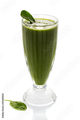 Raw green smoothie with fruits and spinach isolated