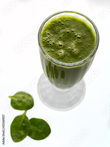 Raw green smoothie with fruits and spinach isolated