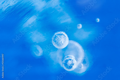 Blue ice with bubbles, background