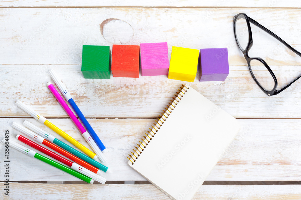 School supplies on wooden background School supplies on wooden background