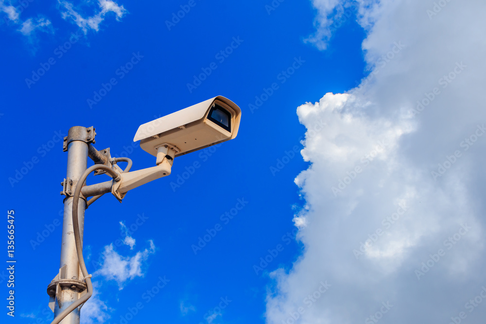 CCTV with blue sky background, surveillance camera system for se CCTV with blue sky background, surveillance camera system for se