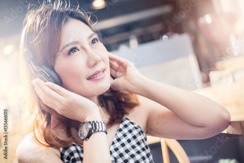 asain beauty girl happy with listening music with light flare effect