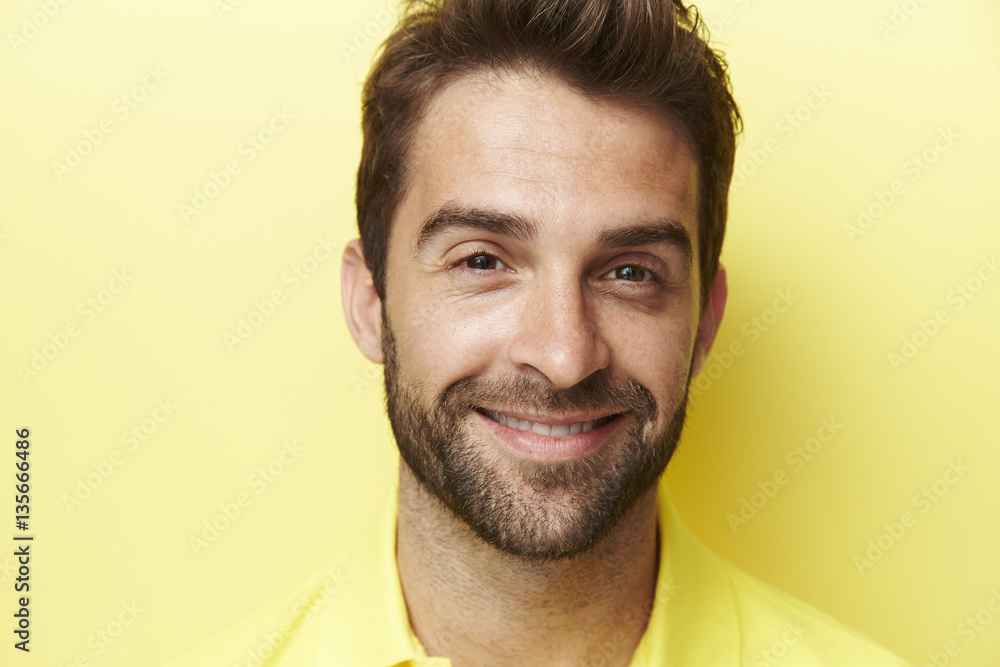 Smiling man in yellow, portrait Smiling man in yellow, portrait