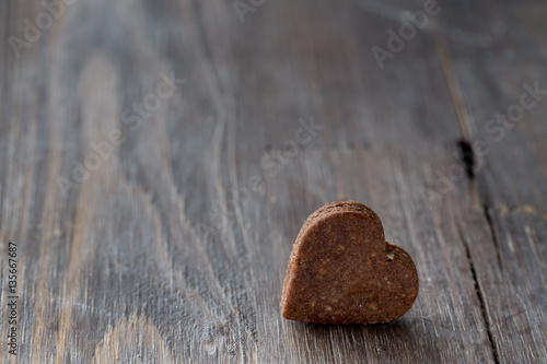 Valentine's chocolate heart cookies on black wooden old background