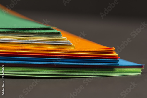 Colorful paper shapes with paper background