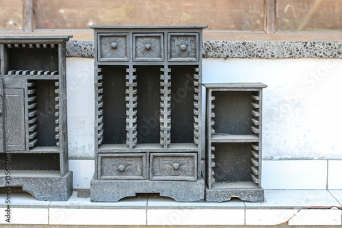 Wooden carved bookcase, dark gray color  