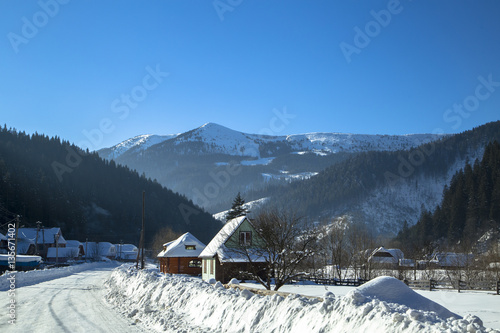 Wooden Home in the mountains. Winter Carpathian mountains
