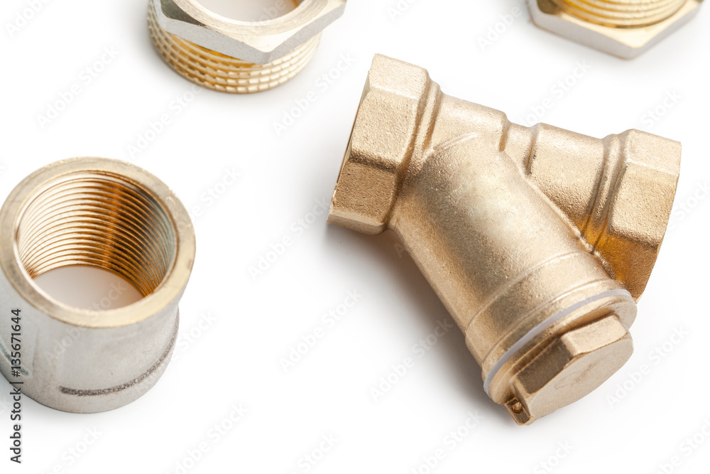 Set of metal-plastic plumbing couplings, adapters, plugs isolated on white background Set of metal-plastic plumbing couplings, adapters, plugs isolated on white background