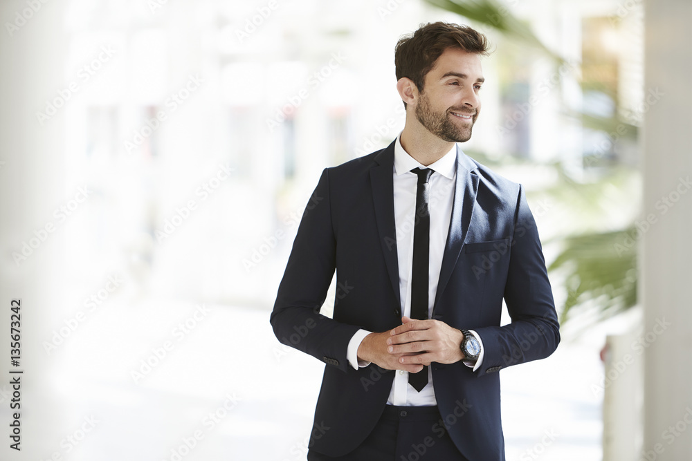 Smiling businessman looking away Smiling businessman looking away