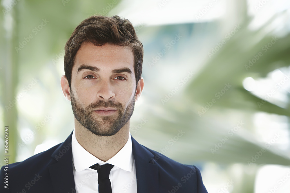 Smart businessman looking at camera Smart businessman looking at camera