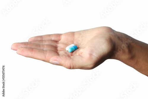 Medicine in palm on white background