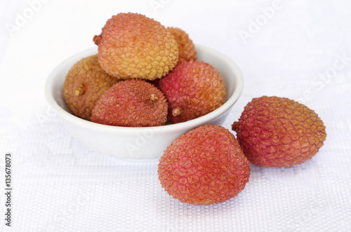 Lychee in a white bowl on the table