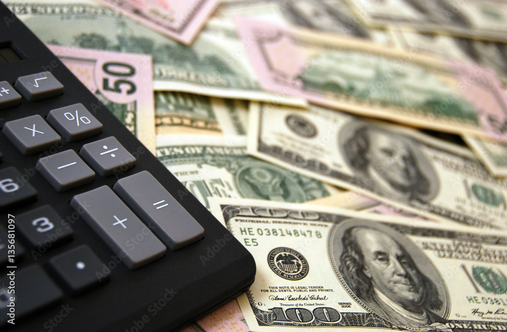 Fototapeta premium Calculator on money background