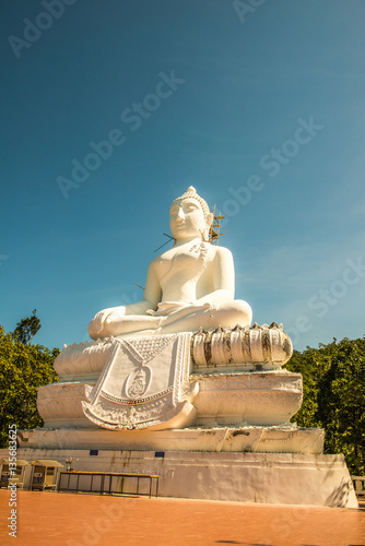 White buddha statue under construction at Phra That Maeyen templ photo