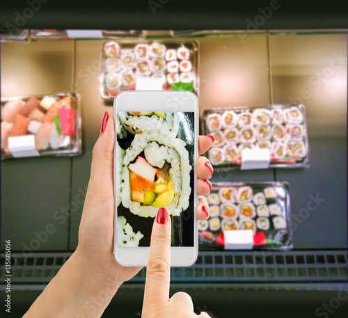 buying sushi with the smartphone photo