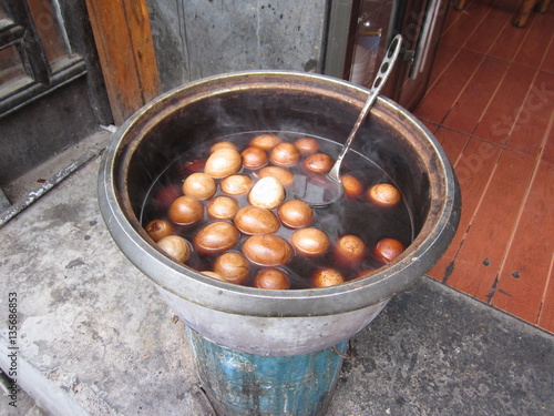 Boiled eggs in black soy sauce. photo