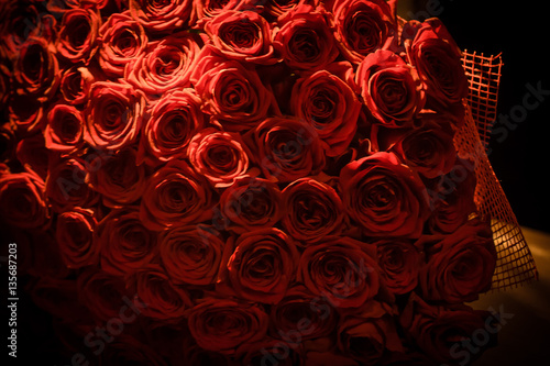 Bouquet of red roses on a dark background