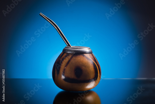 Kalabas isolated on blue gradient background. The ceremony of drinking yerba mate photo