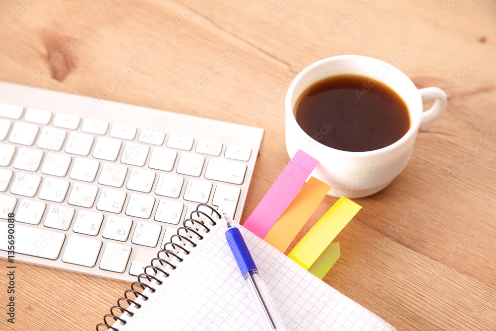 on the desktop computer and a cup of coffee on the desktop computer and a cup of coffee