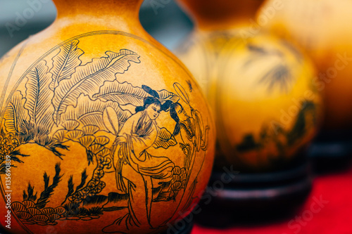 Chinese handmade souvenir - carved Calabash, amulet for good health, money and luck on a street market near Kumbum monastery in Qinghai Sheng, Xining Shi, Huangzhong Xian, China photo