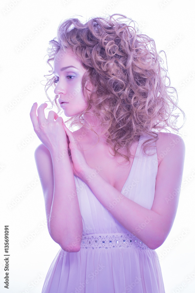 Fashionable and beautiful girl with curl hair. Perfect make-up