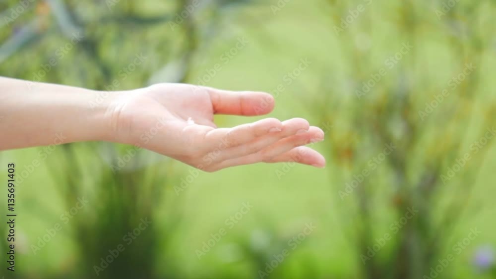 Slow motion of Woman applying moisturizer cream on hand Slow motion of Woman applying moisturizer cream on hand