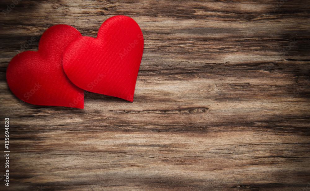 Red hearts on a wooden background Red hearts on a wooden background