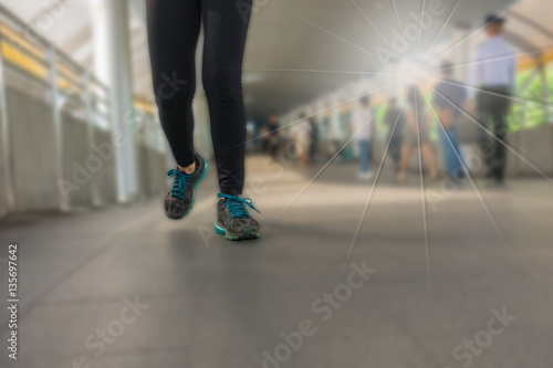 The legs of a woman wearing Legging fitness wear sports shoes ru