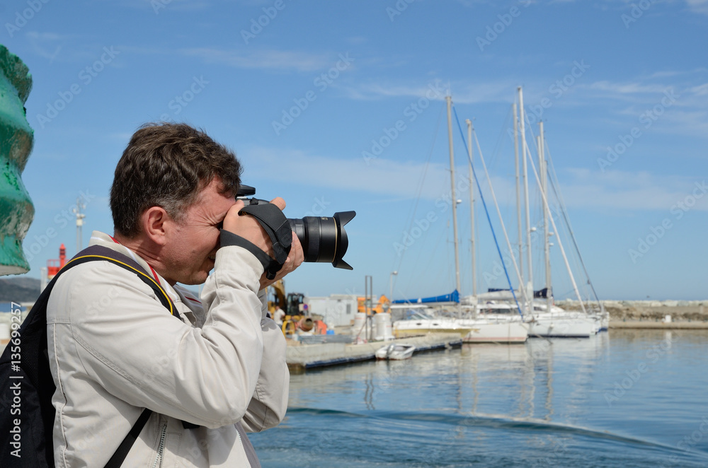 Tourist in the Corsican port Saint-Florent