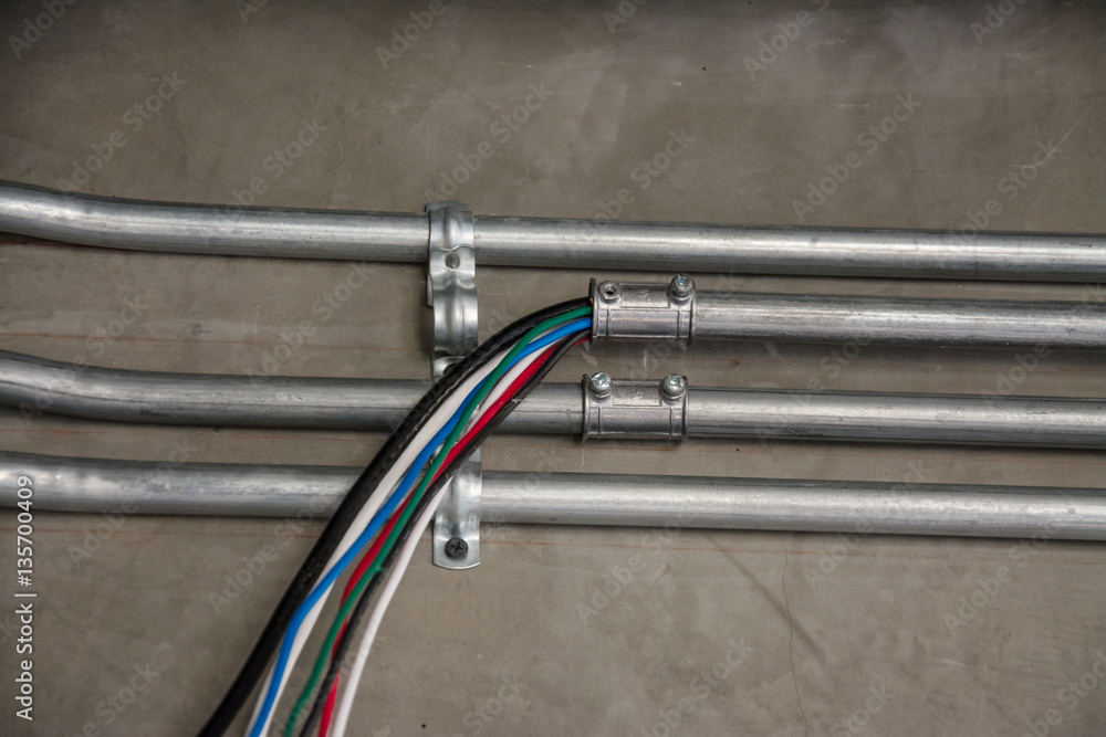 electrical cable in galvanized conduit pipe connection