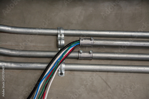 electrical cable in galvanized conduit pipe connection
