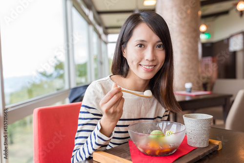 Woman enjoy her dessert in coffee shop