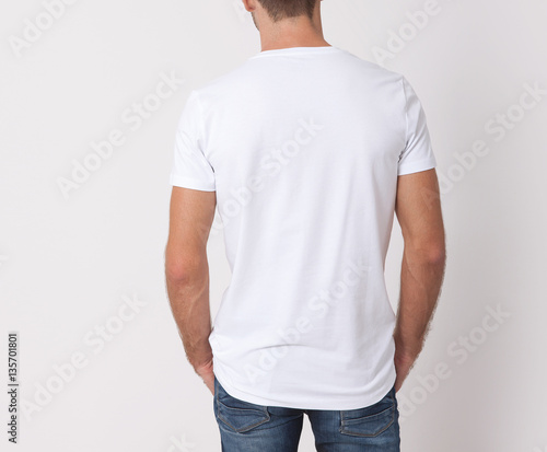 T-shirt design and people concept. Close up of young man in blank white shirt isolated.