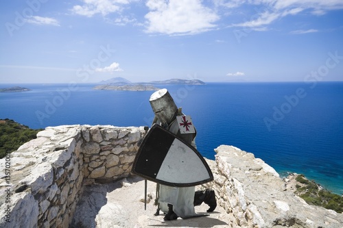 Medieval knight praying in ...